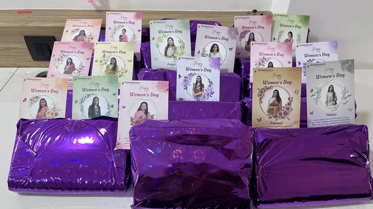Women’s Day gifts and personalised cards laid out for the TechnoBrains team