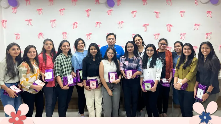 Women of the TechnoBrains team holding their gifts at the Women’s Day celebration