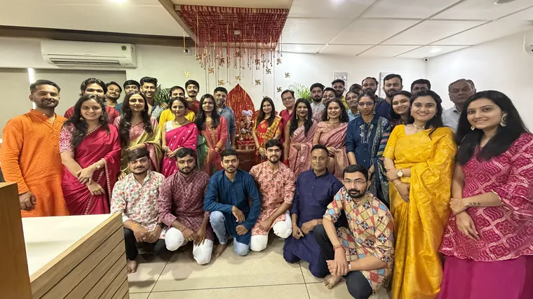 The TechnoBrains team in traditional outfits at a festival celebration in the office