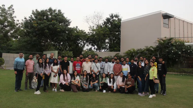 The TechnoBrains team group photo on a lawn during a company outing