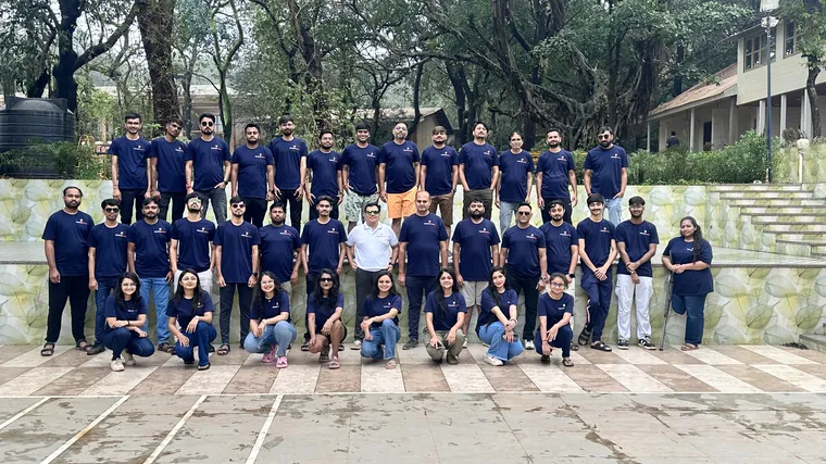 The TechnoBrains team in matching navy T-shirts on a company trip